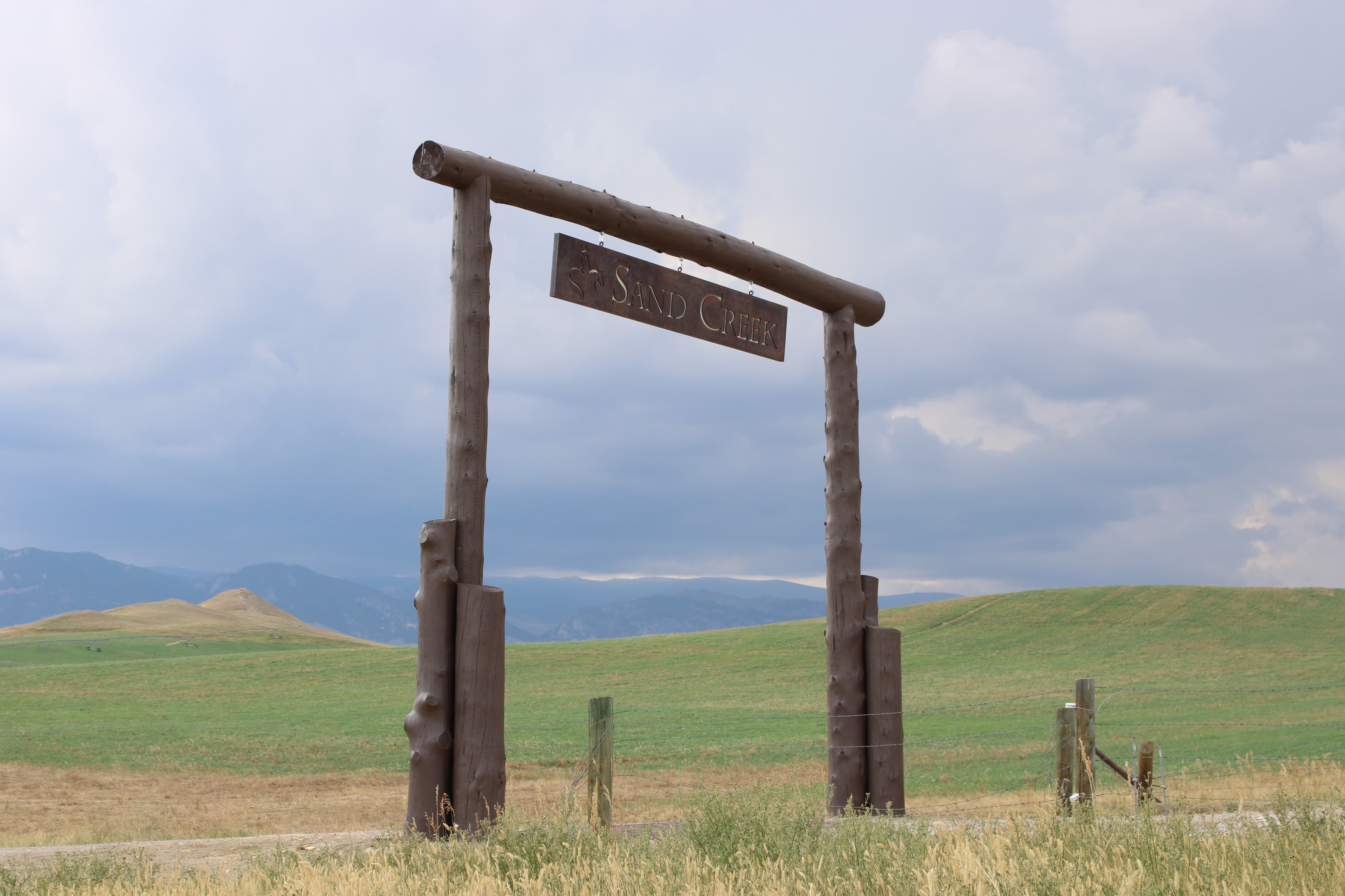 A Wyoming landscape with a ranch entry gate
