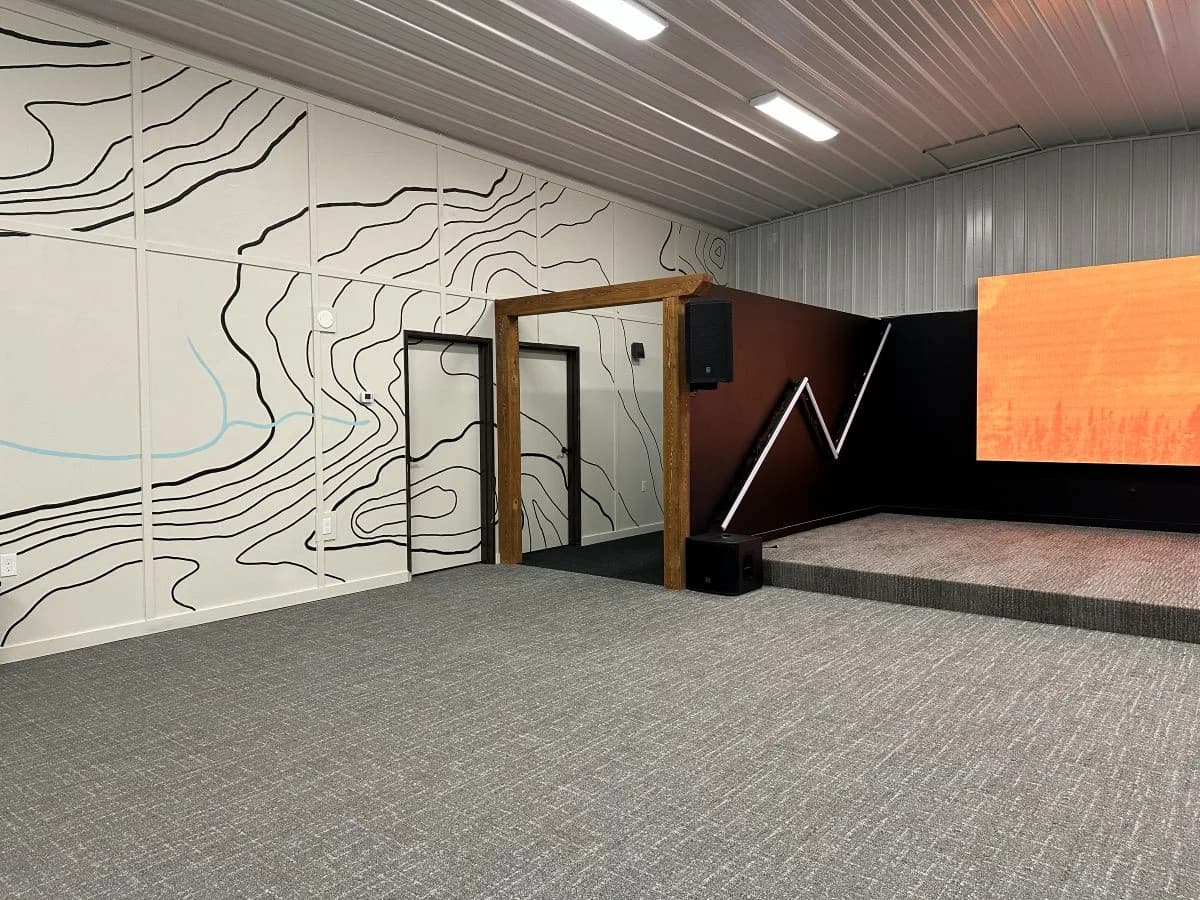 Completed commercial stage construction and auditorium interior for Trailhead Student Ministry by Buffalo Built LLC.