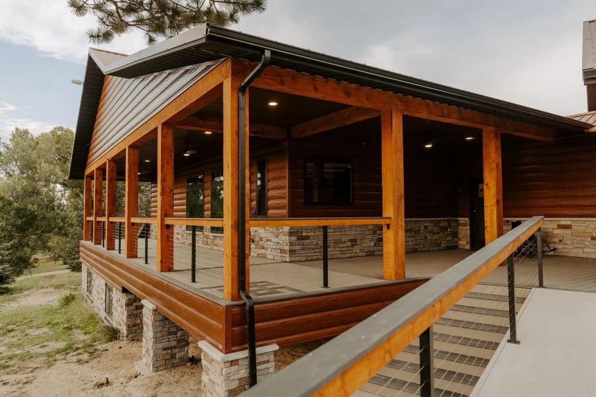 Completed luxury custom timber porch representing expert design build residential construction services by Buffalo Built LLC.