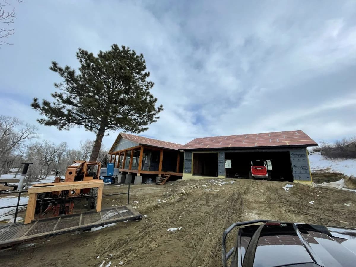 Residential stick framing phase of an expansive custom home and multi-bay garage project by Buffalo Built LLC.
